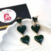 Green heart earrings