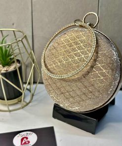 Embellished round clutch